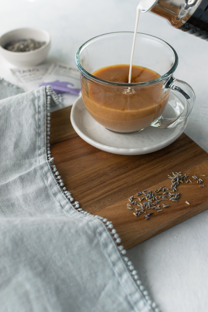 pouring milk into earl grey latte