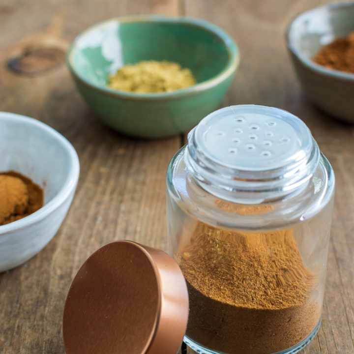 homemade pumpkin pie spice mix in a shaker bottle