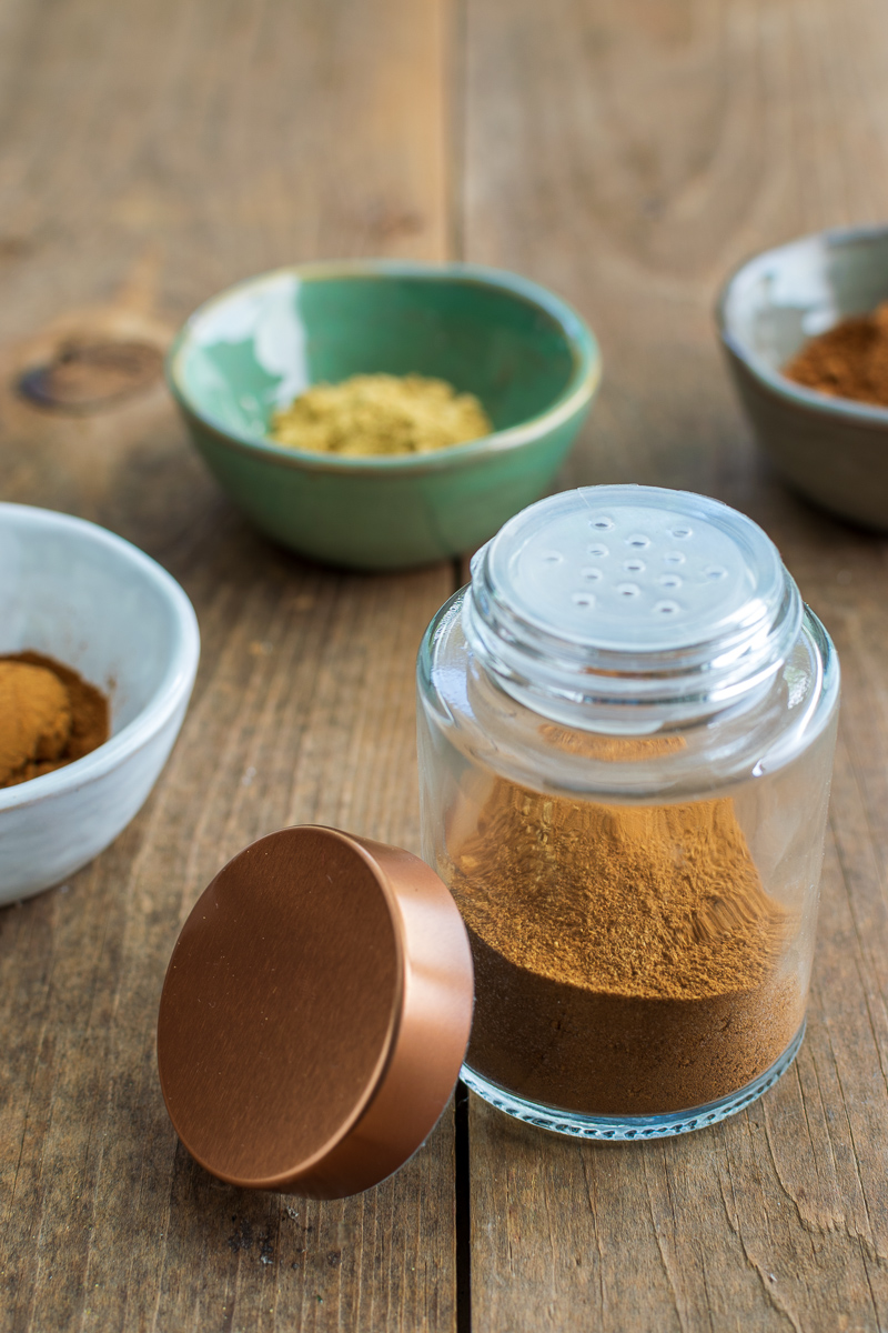 homemade pumpkin pie spice mix in a shaker bottle