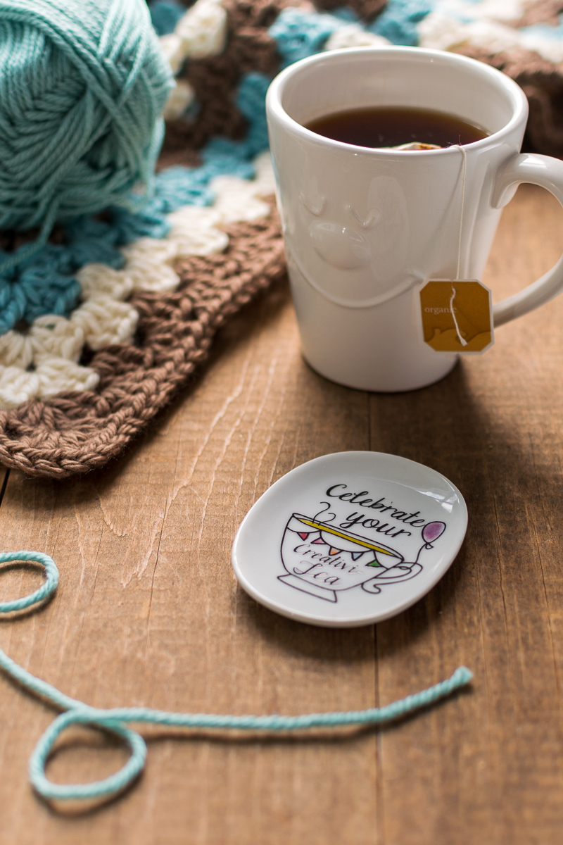 crochet blanket, yarn and cup of tea