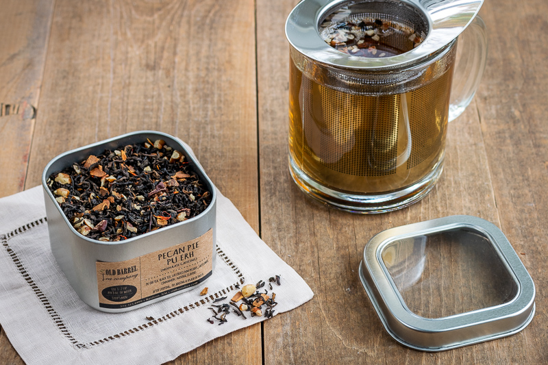 tea tin of pecan pie pu-erh and a tea cup brewing the loose tea