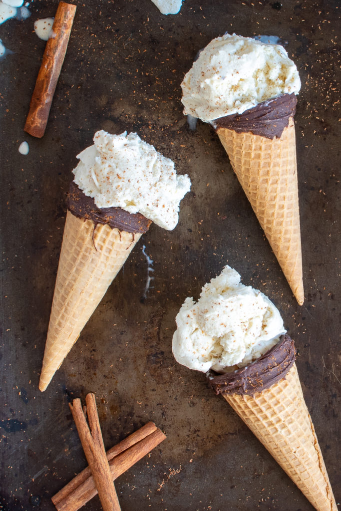homemade cinnamon ice cream in chocolate dipped ice cream cones