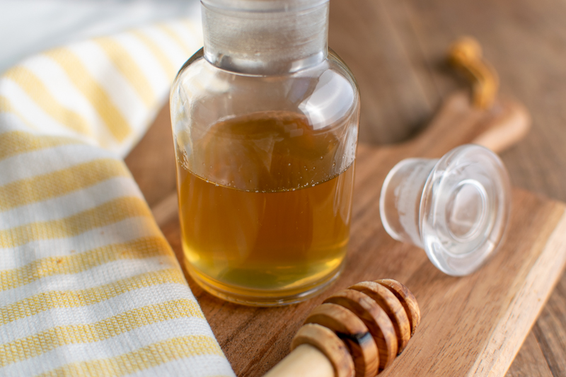 jar of homemade honey simple syrup for coffee and tea