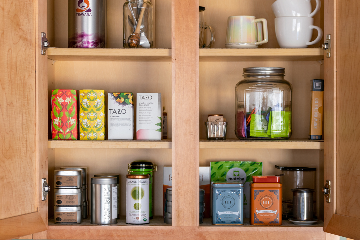 tea cabinet with loose tea and tea bags