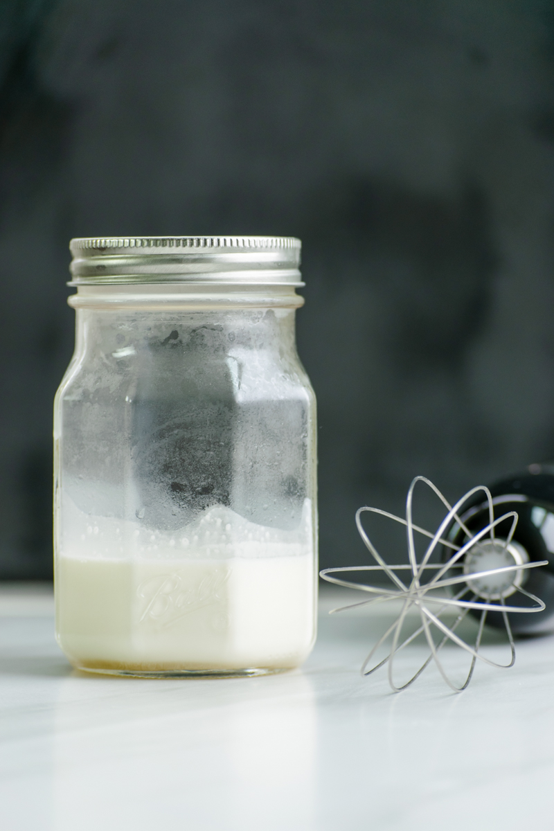 vanilla sweet cream ingredients in a mason jar and whisk