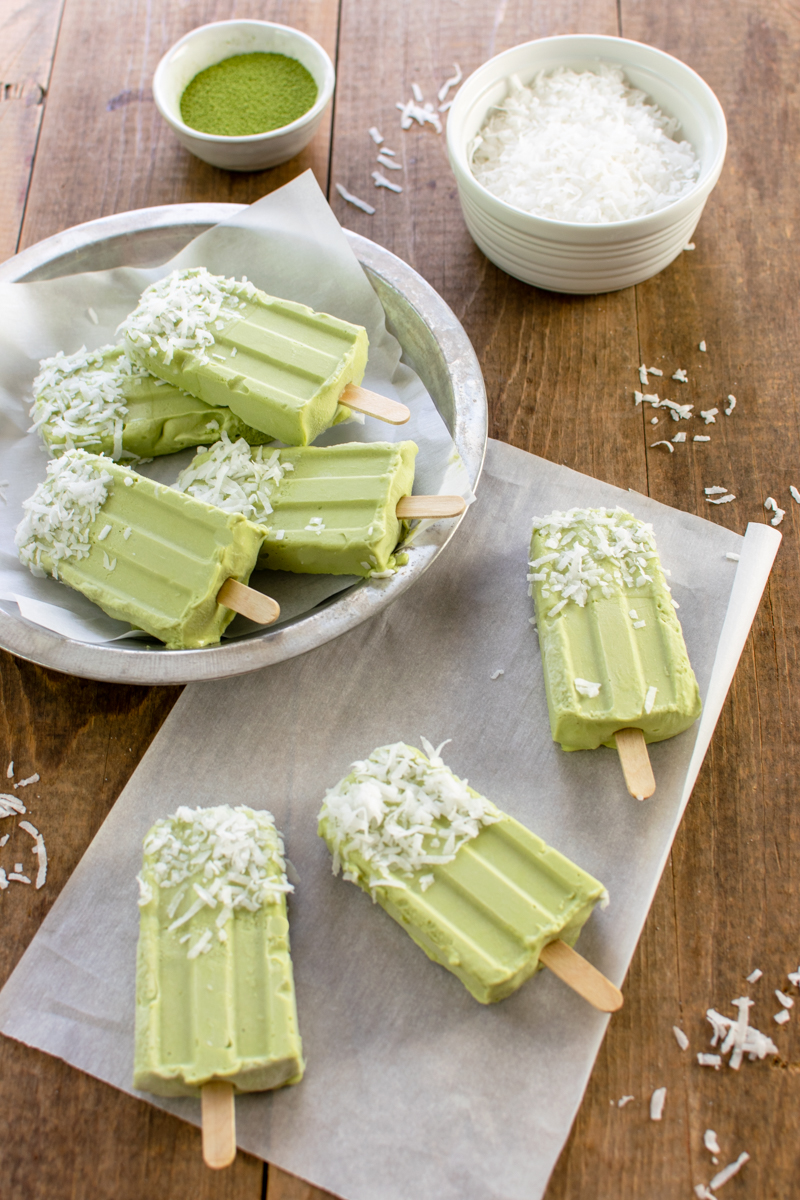 coconut matcha popsicles with sweetened coconut flakes