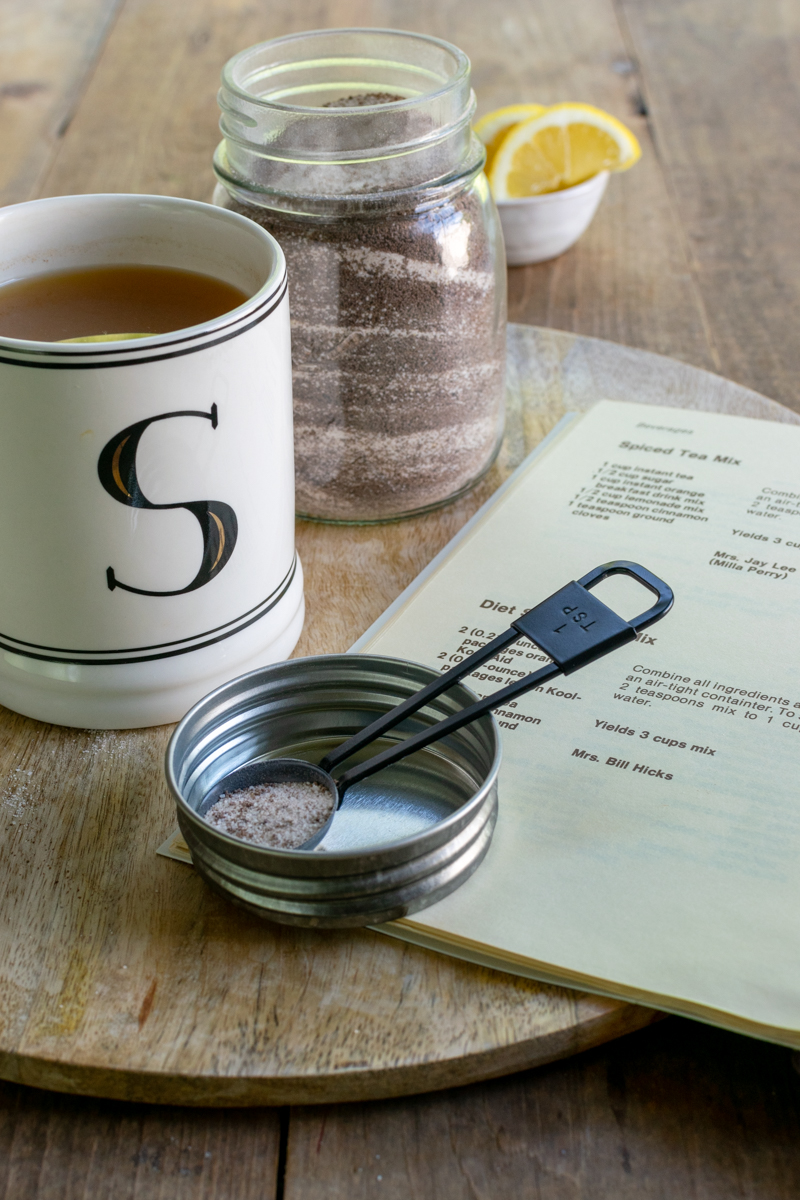 hot mug of spiced tea and recipe book
