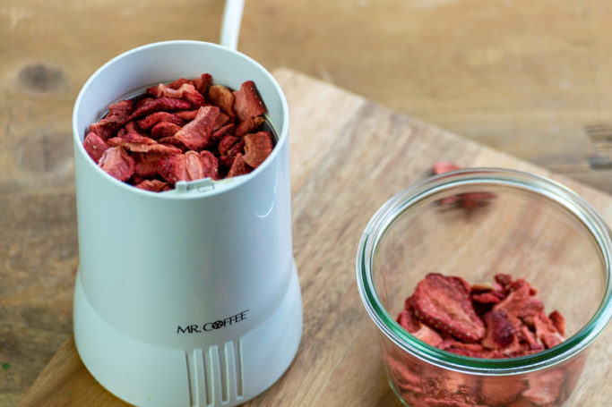 grinding freeze dried strawberries for flavor infused sugar