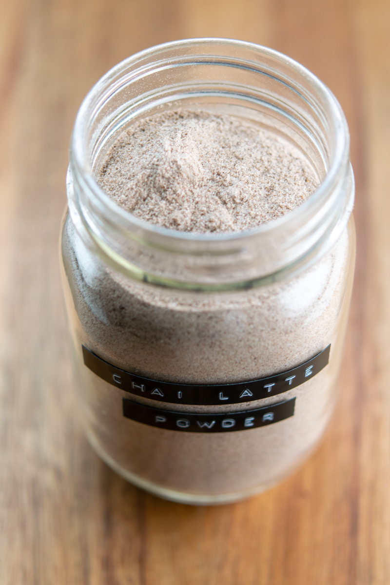 open jar of chai latte mix with a label