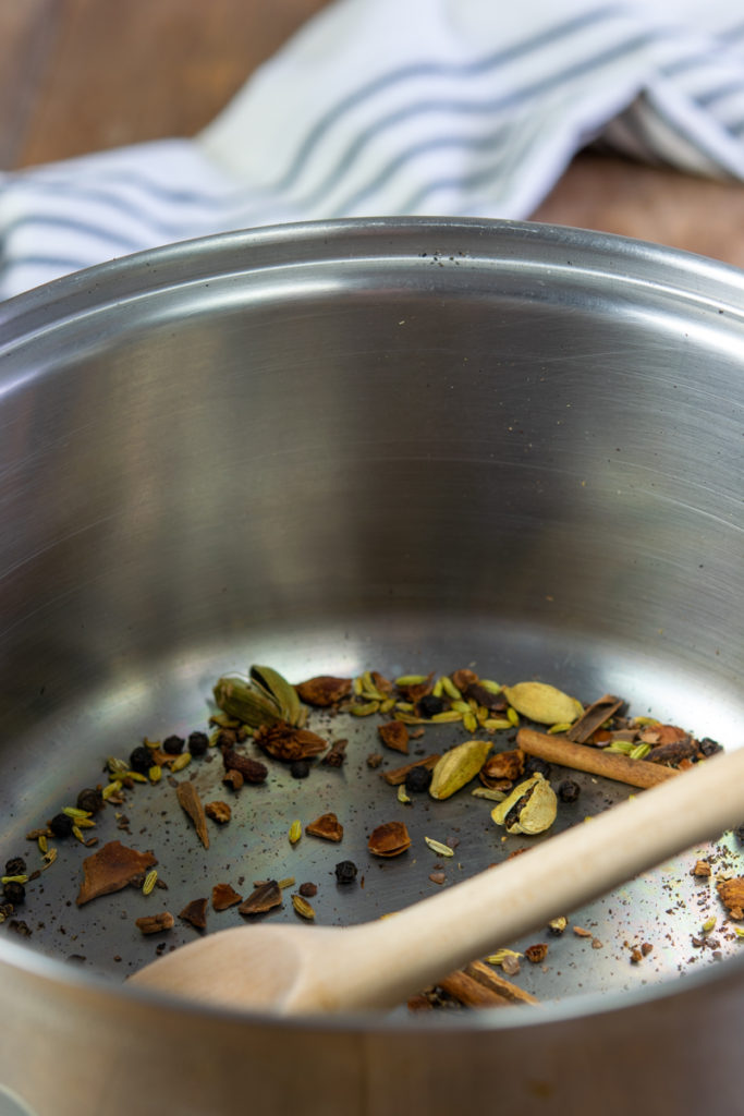 toasting chai spices on stove