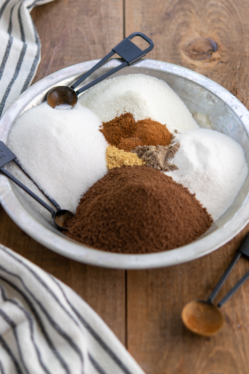 tray with instant tea, sugar, creamer, powdered non-fat milk, cinnamon, ginger, cardamom, cloves and nutmeg