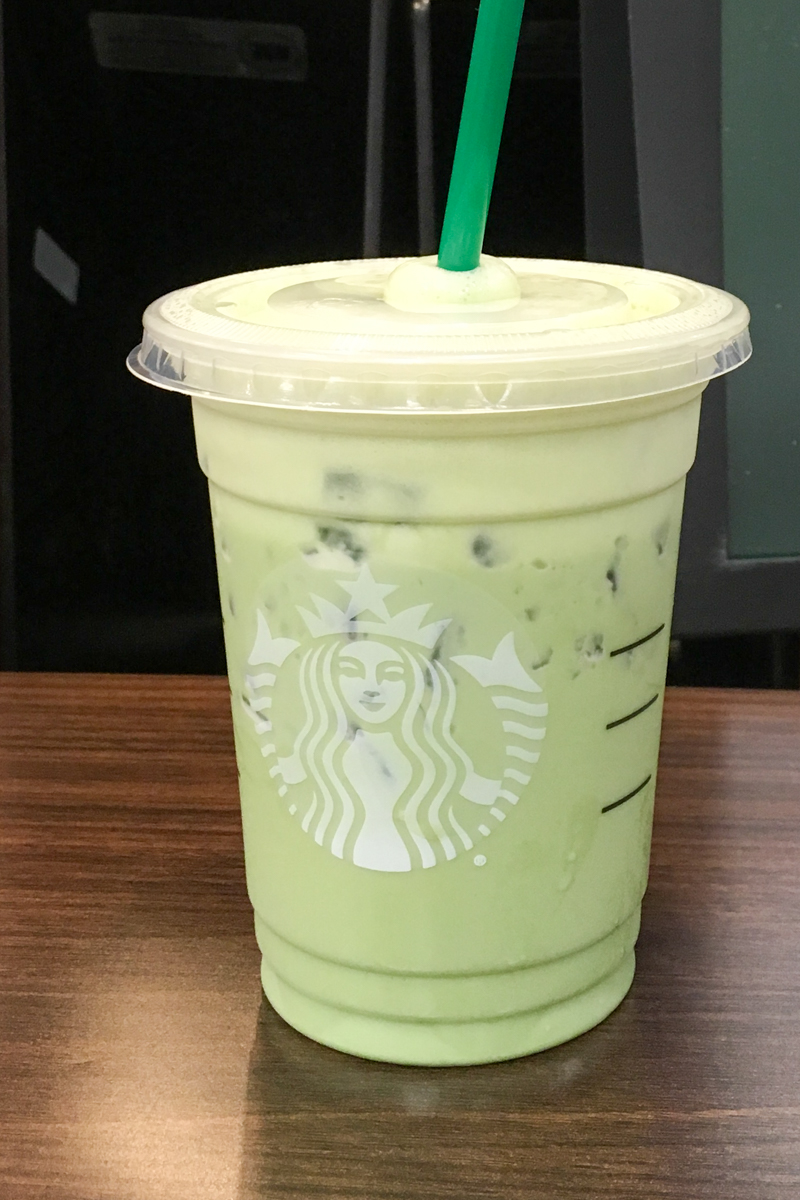 iced matcha green tea latte sitting on starbucks counter