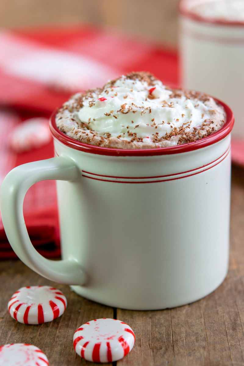 copycat starbucks hot chocolate with peppermint syrup topped with chocolate and peppermint candies