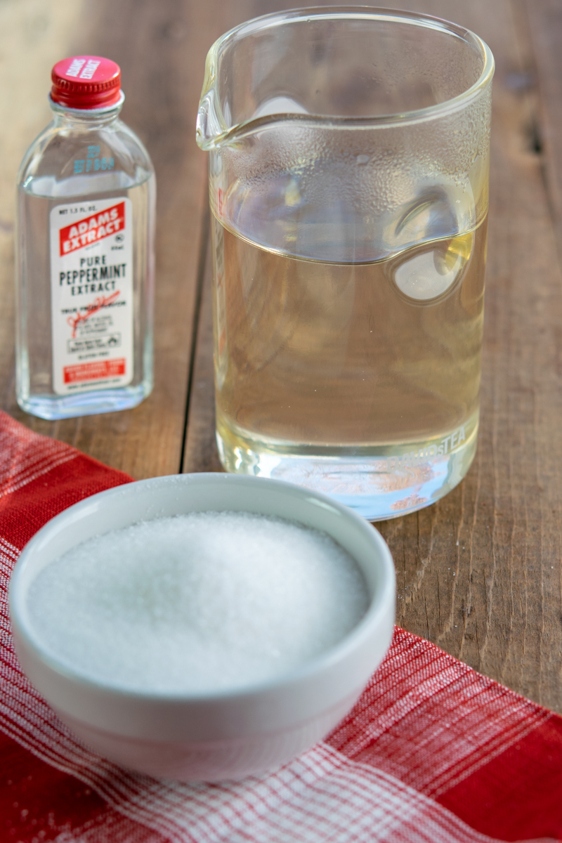 cooling homemade peppermint syrup in glass jar