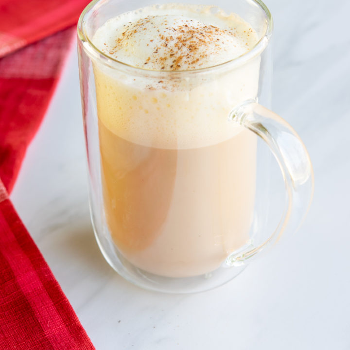 starbucks copycat chai eggnog latte with nutmeg sprinkled on top