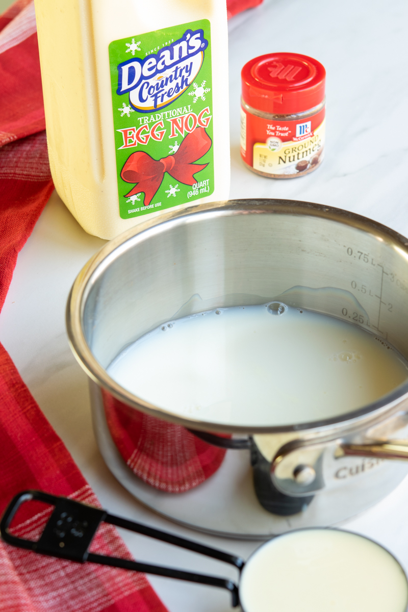 eggnog and milk being steamed to make a latte