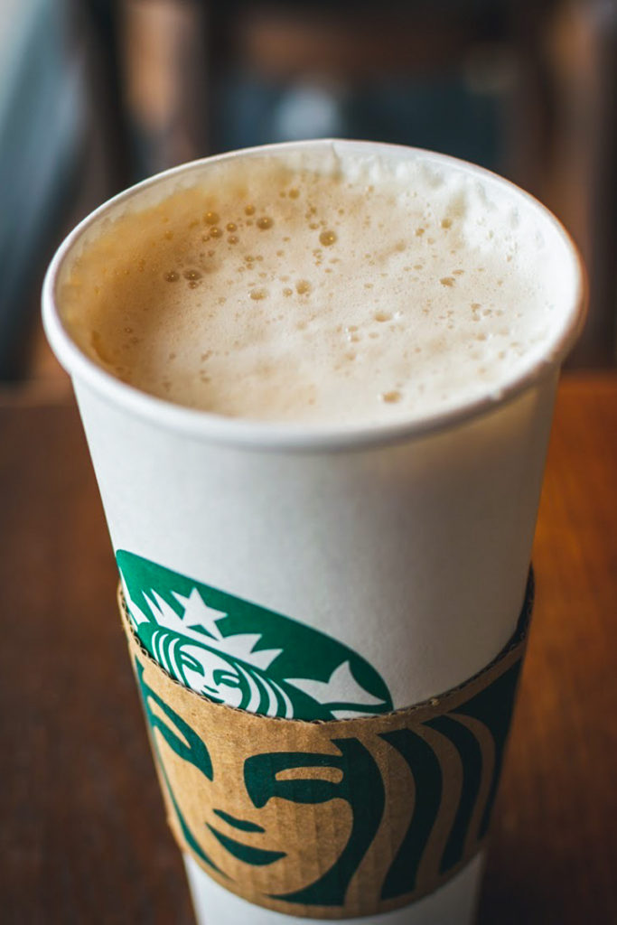 hot starbucks chai latte with lid off