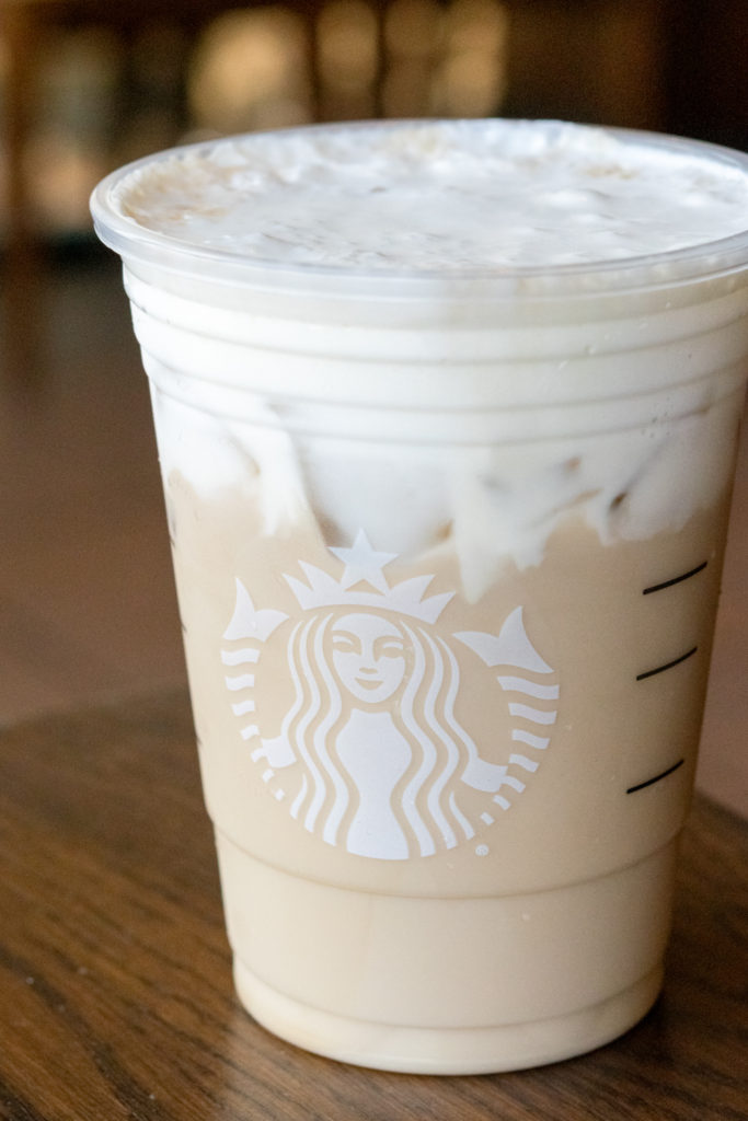Starbucks Iced Chai Tea Latte customized with topping of vanilla sweet cream cold foam.