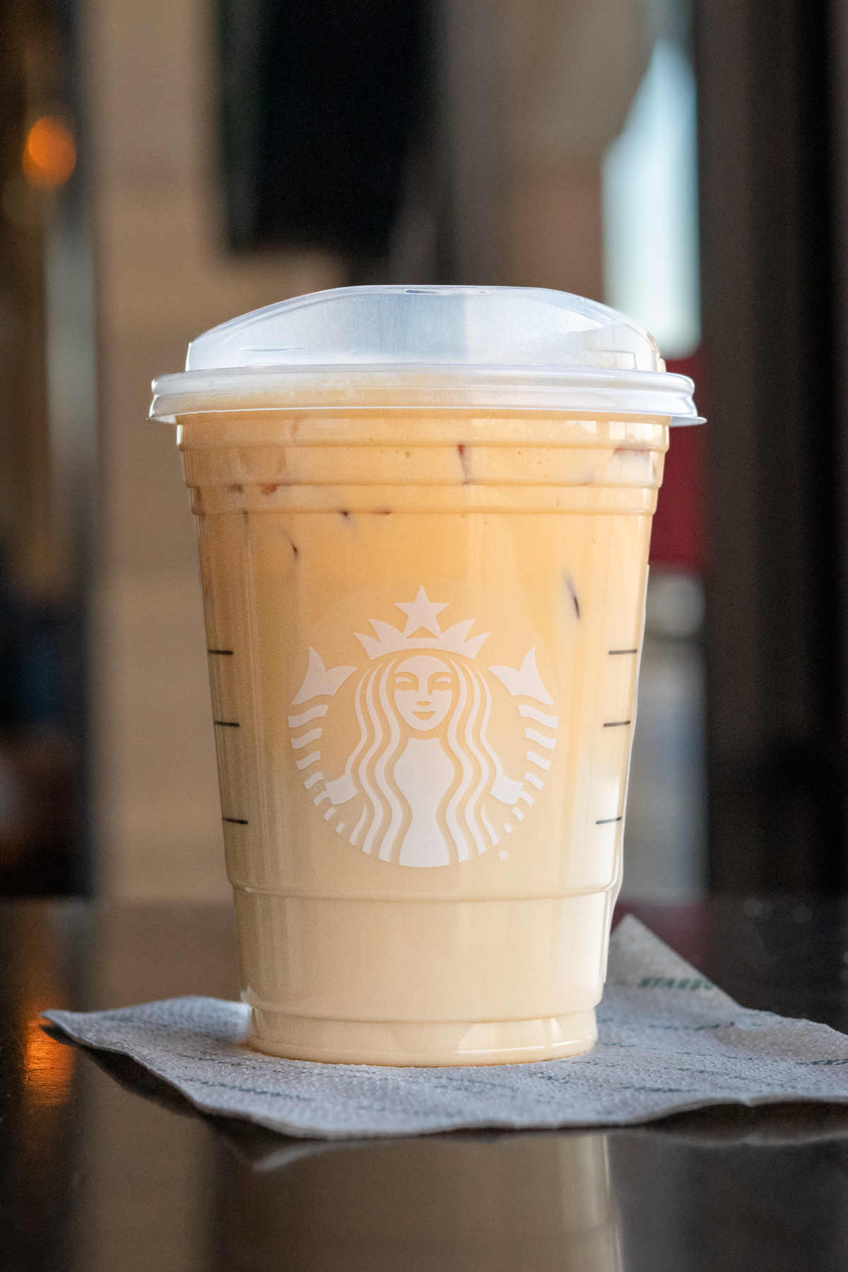 Starbucks Iced Chai Tea Latte with pumpkin cold foam topping.
