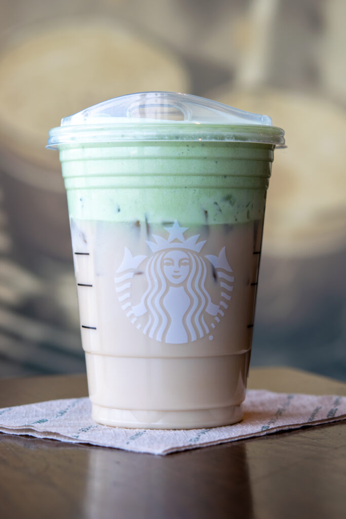 Starbucks chai tea latte modified with matcha cold foam on top.