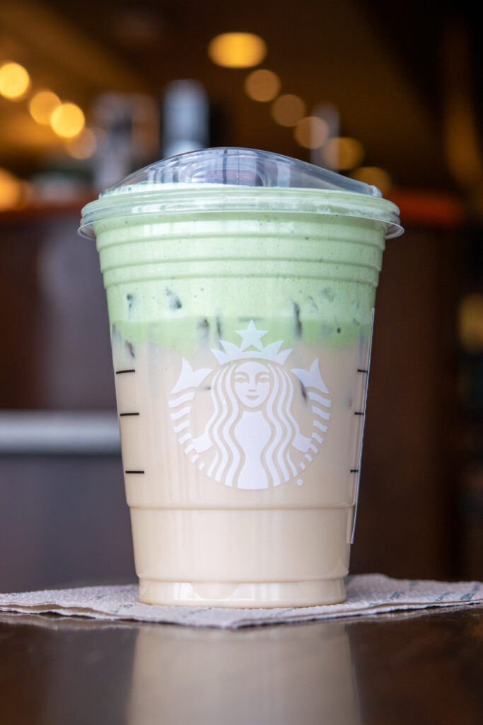 Starbucks iced chai tea latte topped with a creamy layer of matcha cold foam.