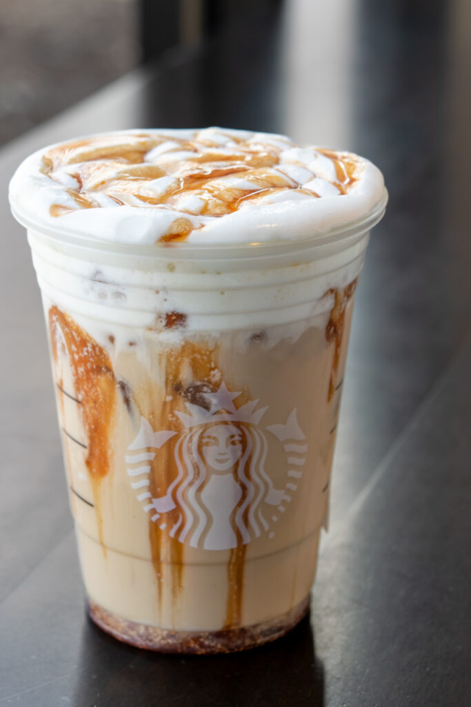 Starbucks iced chai latte with vanilla sweet cream cold foam and apple spice drizzle.