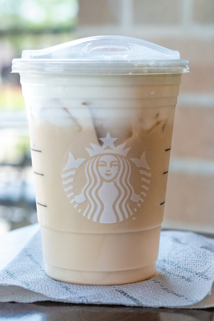 A Starbucks iced chai tea latte ordered with a topping of vanilla sweet cream cold foam.