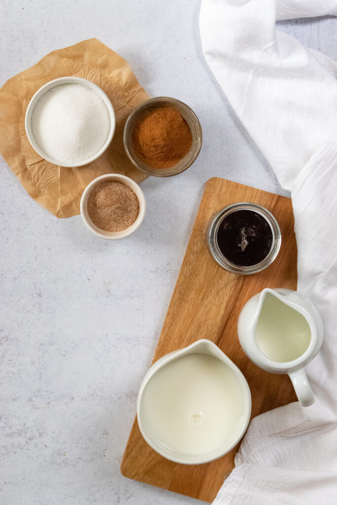 Ingredients to make a cinnamon dolce creme steamer at home.