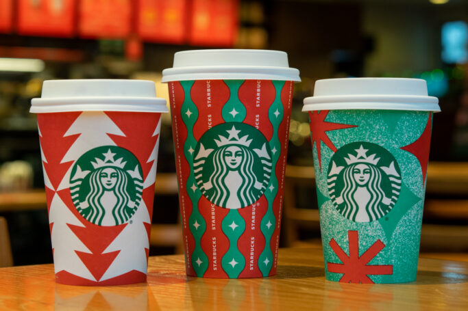 Three Starbucks holiday drinks lined up.