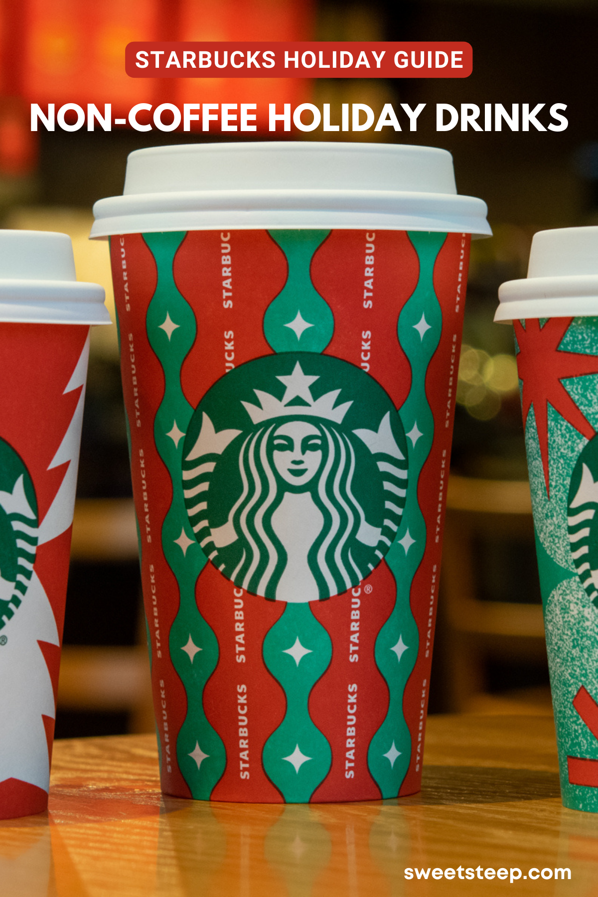 Three Starbucks holiday drinks without coffee in red holiday cups.