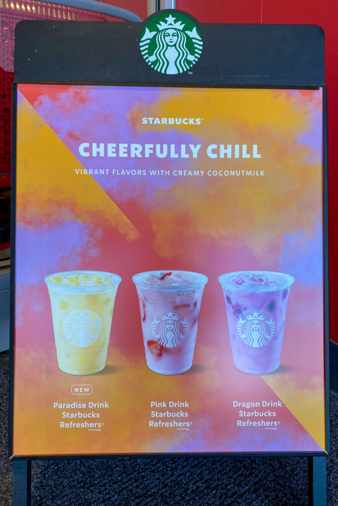 A Starbucks sign showing the three coconutmilk Refreshers.