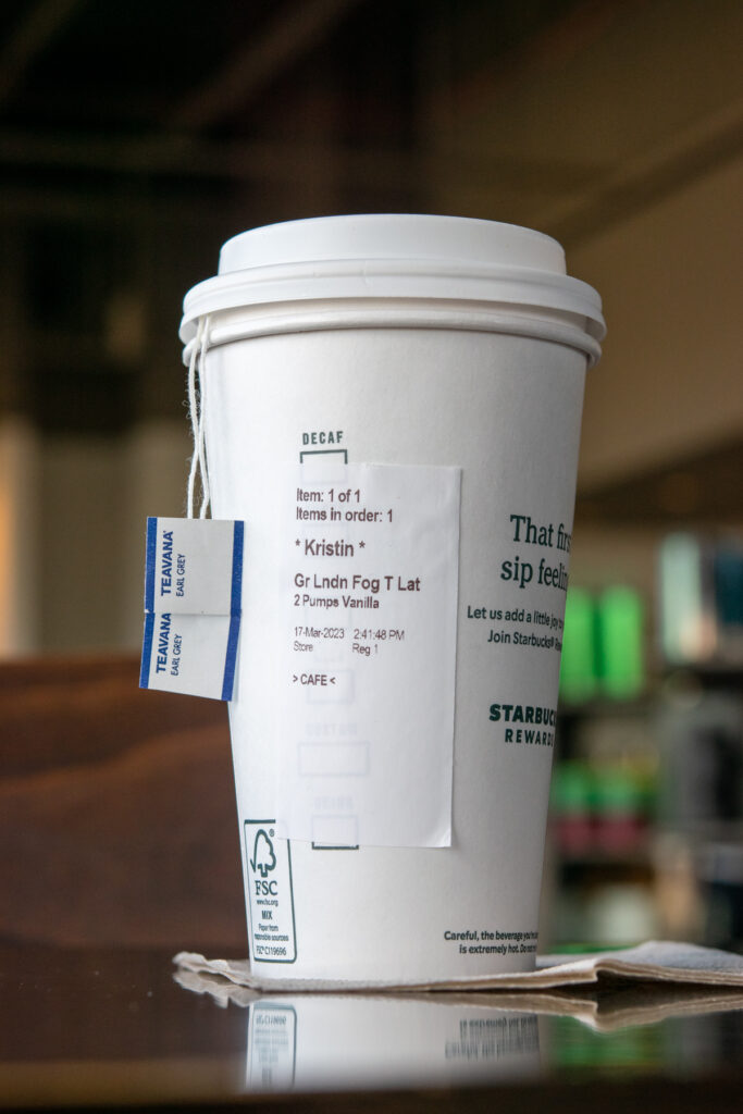 Grande Starbucks London Fog latte with two earl grey tea bags and order sticker.
