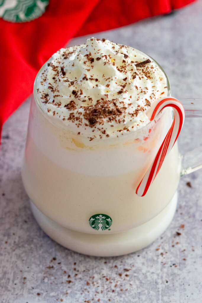 Peppermint white hot chocolate made like Starbucks with bits of chocolate sprinkled on the whipped cream.