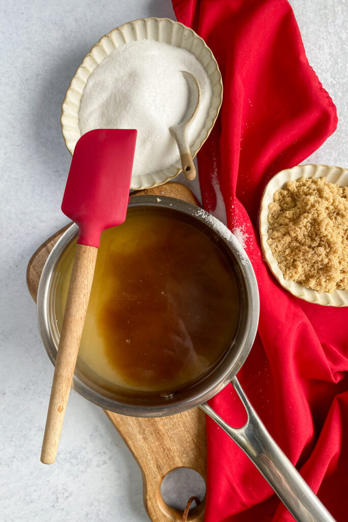 Saucepan on stove making sugar cookie coffee syrup.