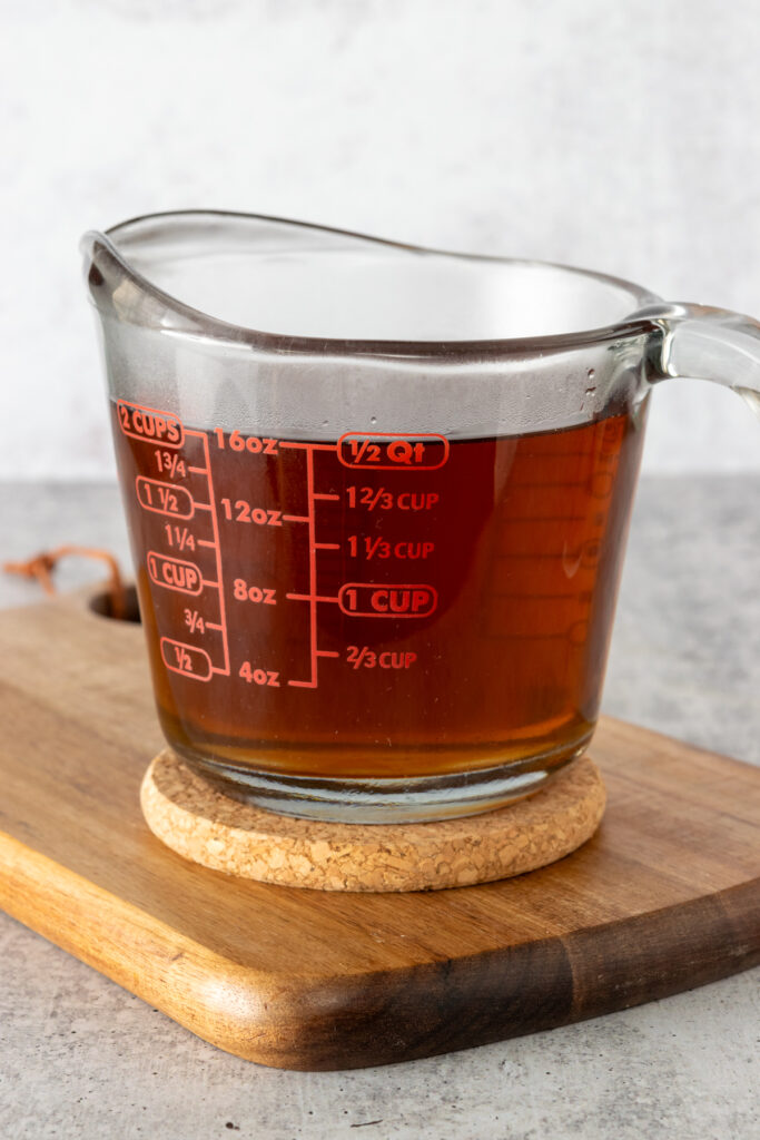 The cookie butter syrup is cooling in a glass Pyrex measuring cup. You can see the recipe yielded 2 cups of homemade syrup.