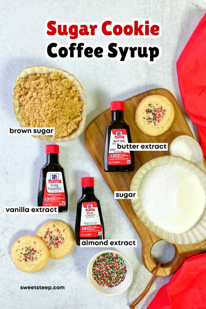 Overhead picture showing all the ingredients needed to make sugar cookie coffee syrup, including white sugar, light brown sugar, vanilla extract, butter extract, and almond extract.