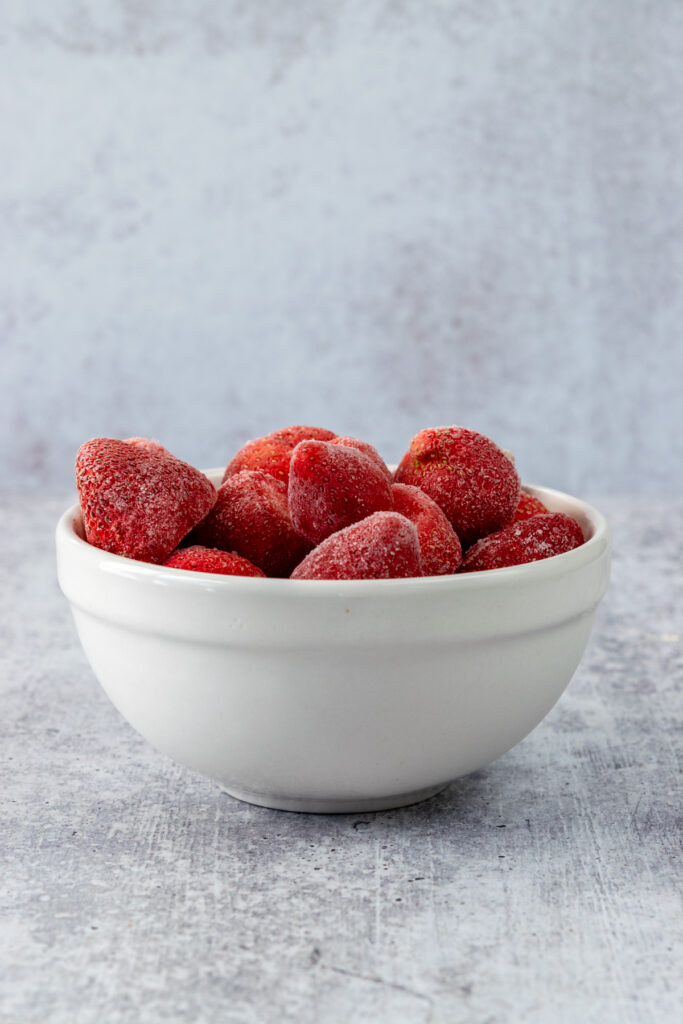 Bowl of frozen whole strawberries.