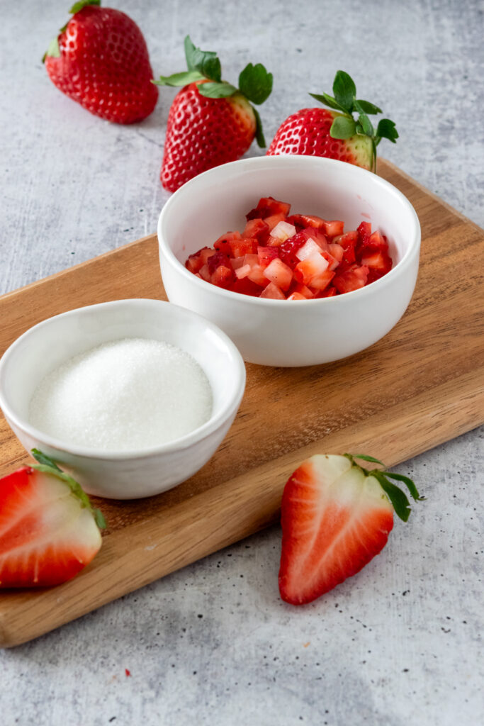 Diced fresh strawberries in a small bowl.