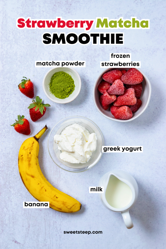 An overhead photo showing all the ingredients needed to make this strawberry matcha smoothie recipe, including a ripe banana, frozen strawberries, matcha powder, greek yogurt and milk.