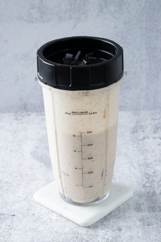 The smoothie blended, still in the blender cup.