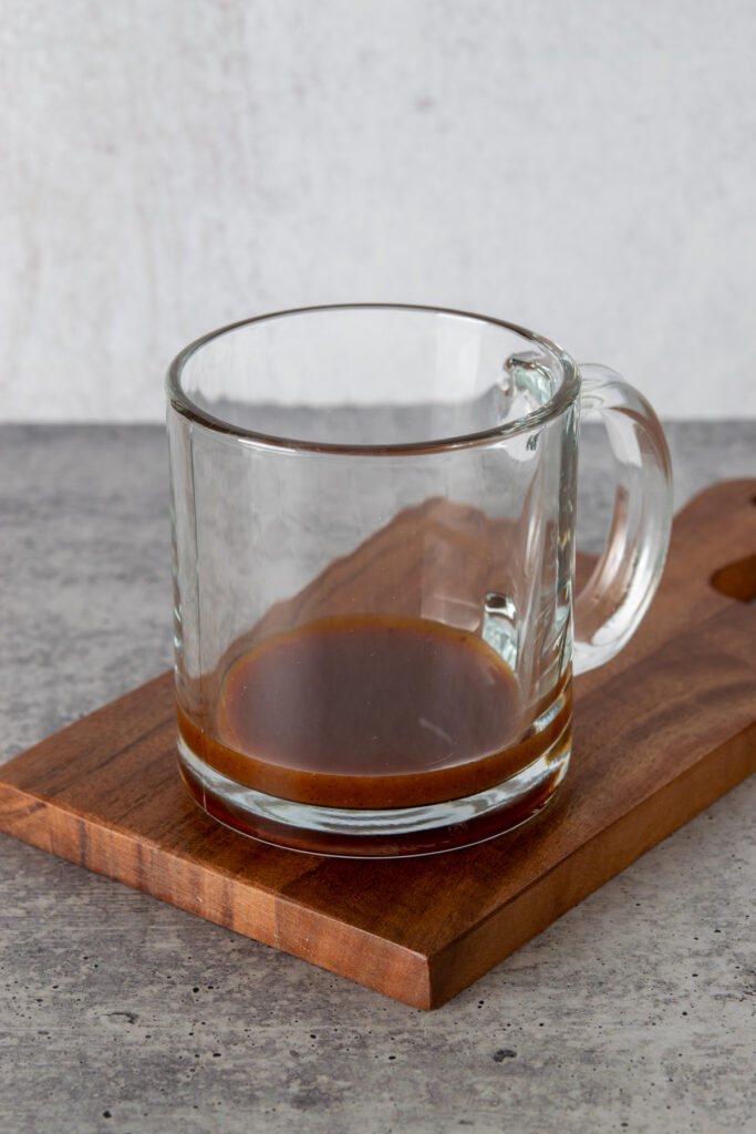 Pumpkin syrup in a mug.