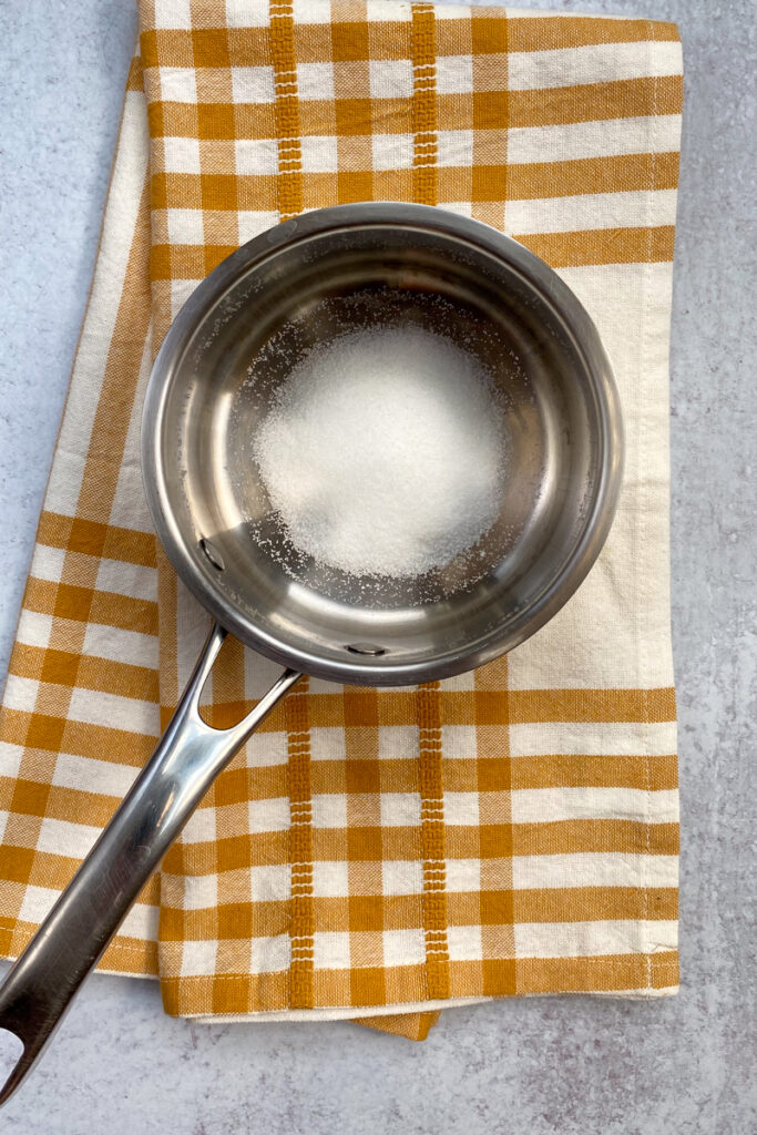 Sugar in a saucepan.