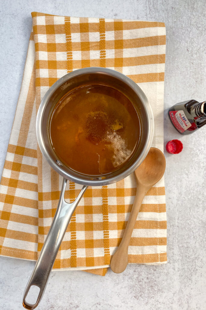 Adding vanilla to the pumpkin spice syrup.