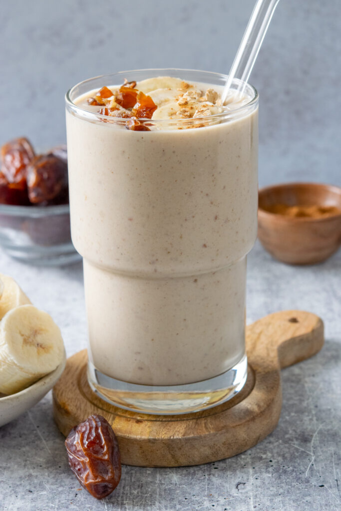 Super creamy banana date smoothie with oats for a filling breakfast.