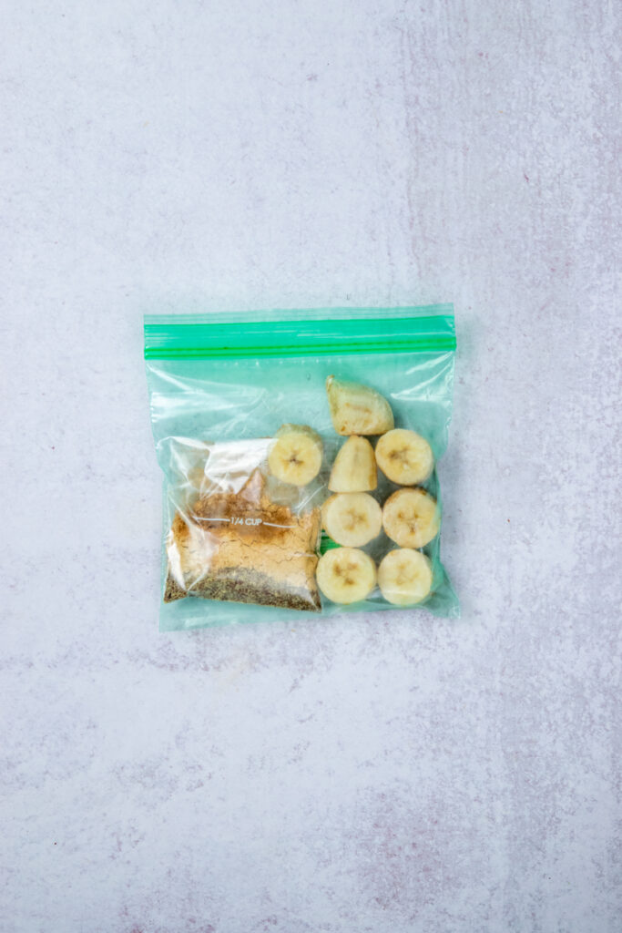 A homemade smoothie freezer pack that's conveniently ready to blend with the liquid ingredients and dates for a quick, high-protein breakfast smoothi.