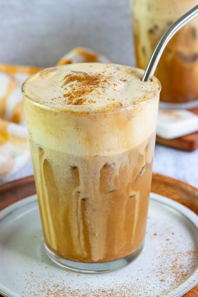 Homemade pumpkin brown sugar shaken espresso topped with thick pumpkin cold foam and a sprinkle of pumpkin pie spice.